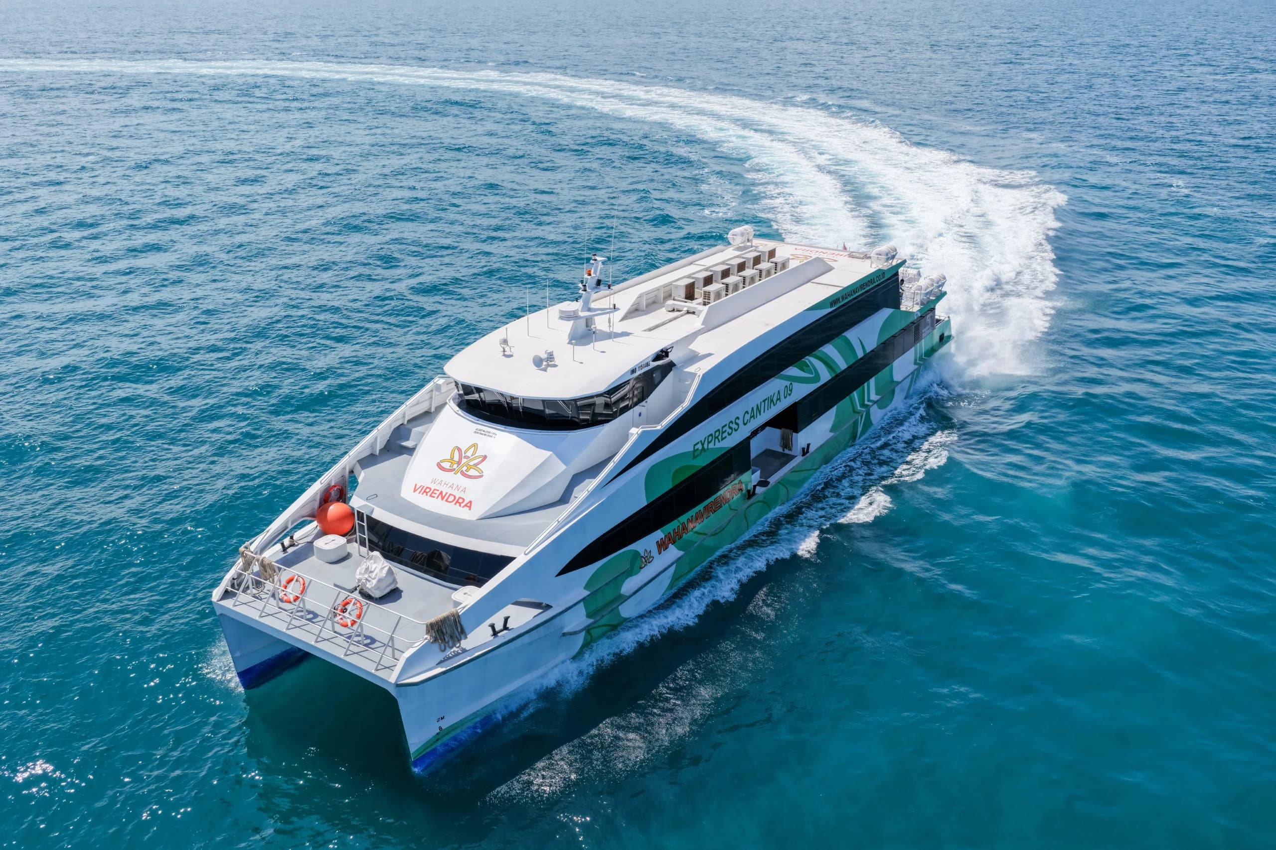 Wahana Virendra fast boat crossing turquoise waters between Bali and the Gili Islands